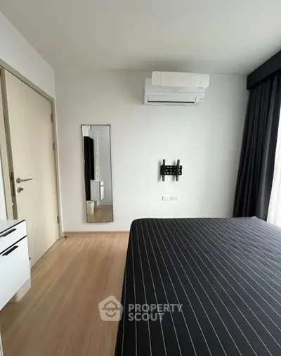 Modern bedroom with air conditioning and sleek design