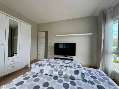 Modern bedroom with stylish decor and natural light