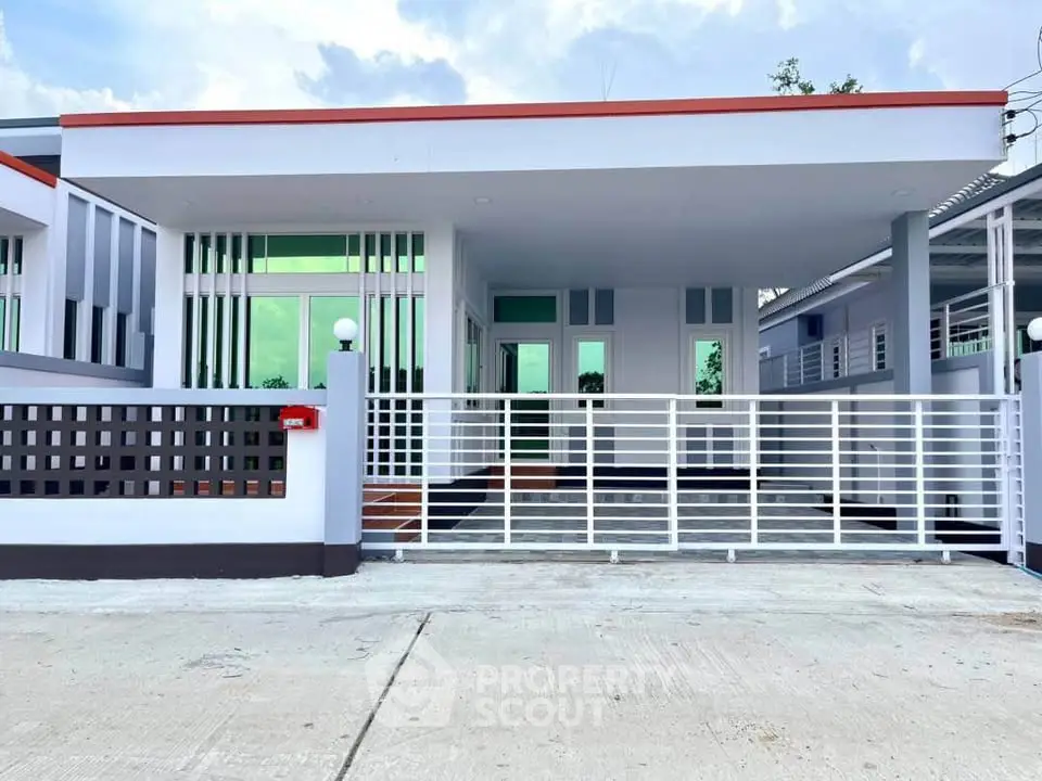 Modern single-story house with sleek design and gated entrance, perfect for contemporary living.