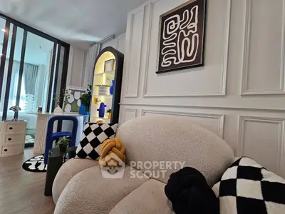 Stylish modern living room with unique decor and cozy seating in a contemporary apartment.