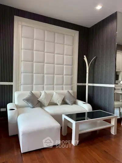 Modern living room with elegant white sofa and stylish decor