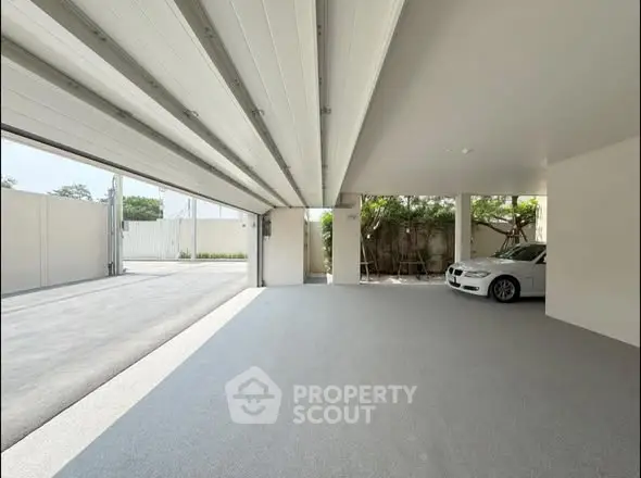 Spacious modern garage with sleek design and ample parking space.