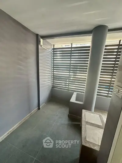 Modern balcony with sleek design and privacy screen