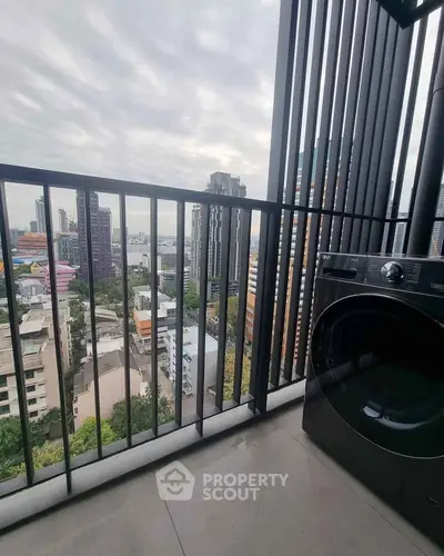 Stunning high-rise balcony with city view and modern washing machine.