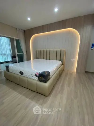 Luxurious bedroom with modern lighting and elegant bed design