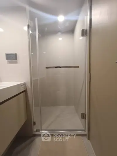 Modern bathroom with glass shower door and sleek design