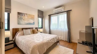 Cozy bedroom with modern decor and natural light