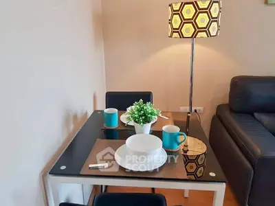 Cozy dining area with modern decor and stylish lighting in a contemporary apartment.