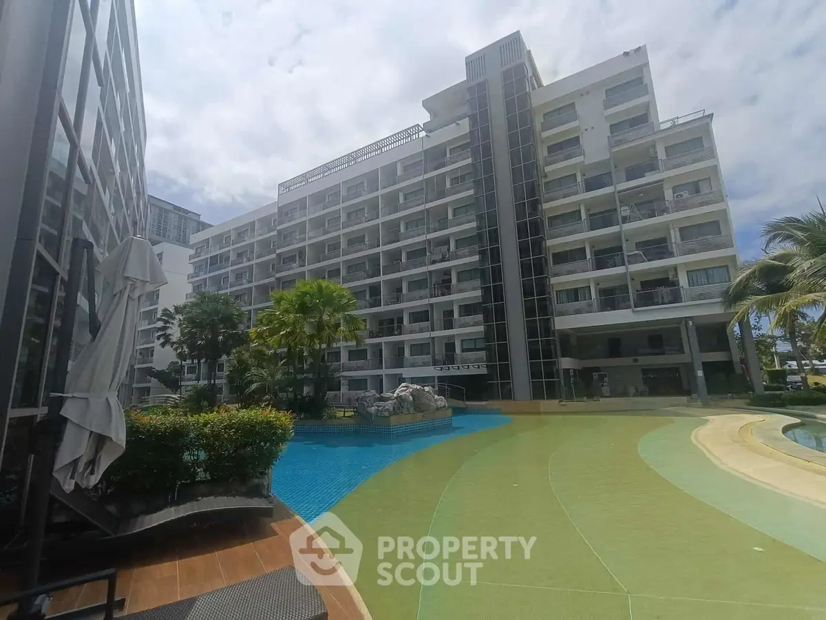 Luxurious apartment complex with pool and lush landscaping