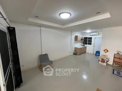 Spacious living room with modern lighting and minimalistic decor