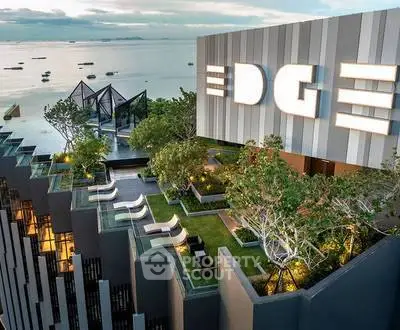 Luxurious rooftop garden with stunning ocean view at modern high-rise building.