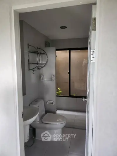 Modern bathroom with sleek design and large window for natural light