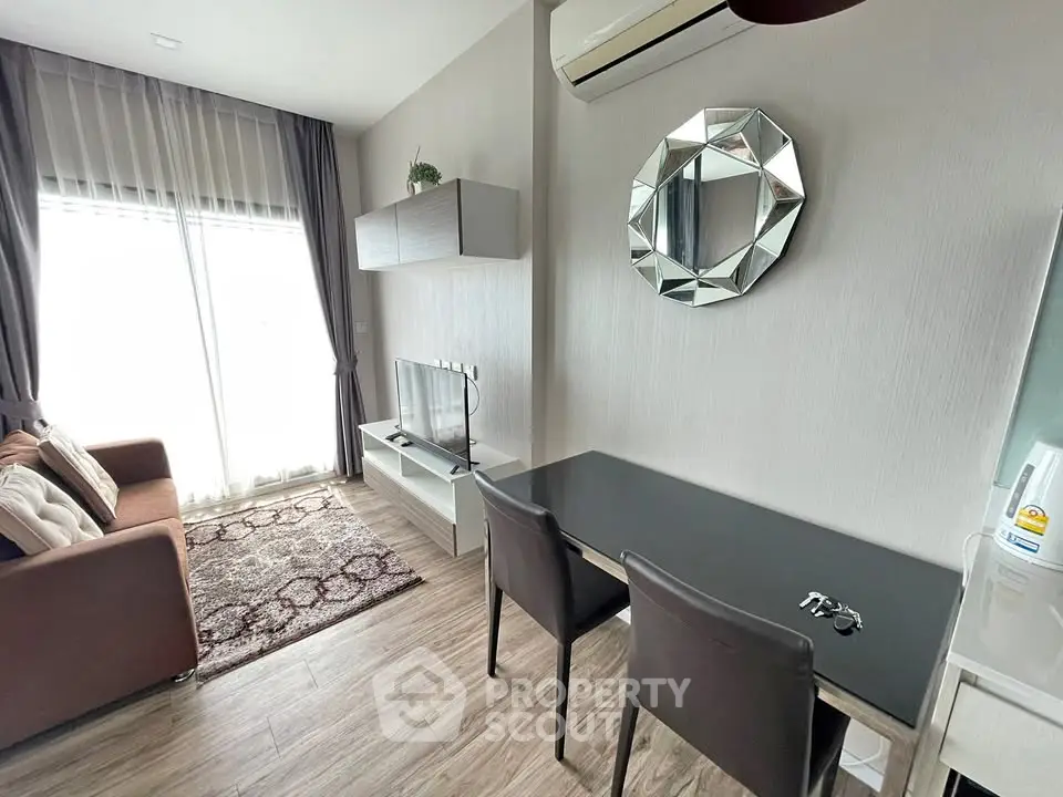Modern living room with stylish decor, featuring a cozy sofa, sleek TV stand, and elegant wall mirror.