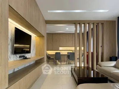 Modern living room with sleek wooden paneling and integrated TV unit