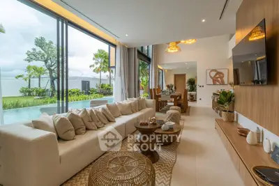 Luxurious open-plan living room with pool view and modern decor