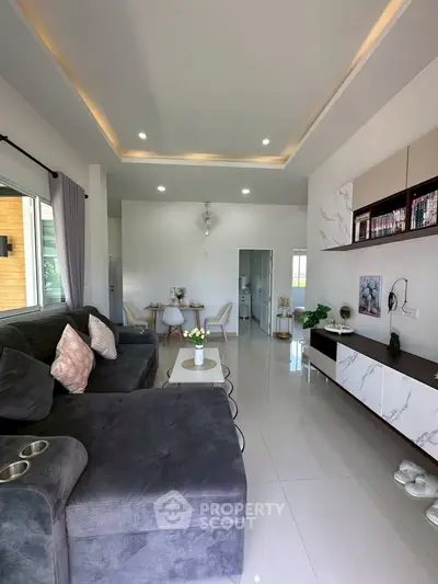 Modern living room with sleek design and cozy seating area