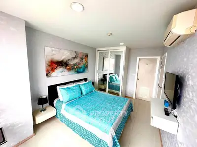 Modern bedroom with stylish decor and mirrored closet doors