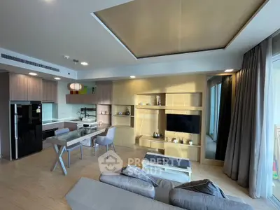 Modern open-layout living room with stylish kitchen and elegant decor