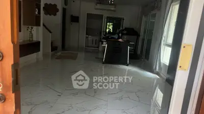 Spacious interior with marble flooring and modern decor, perfect for stylish living.