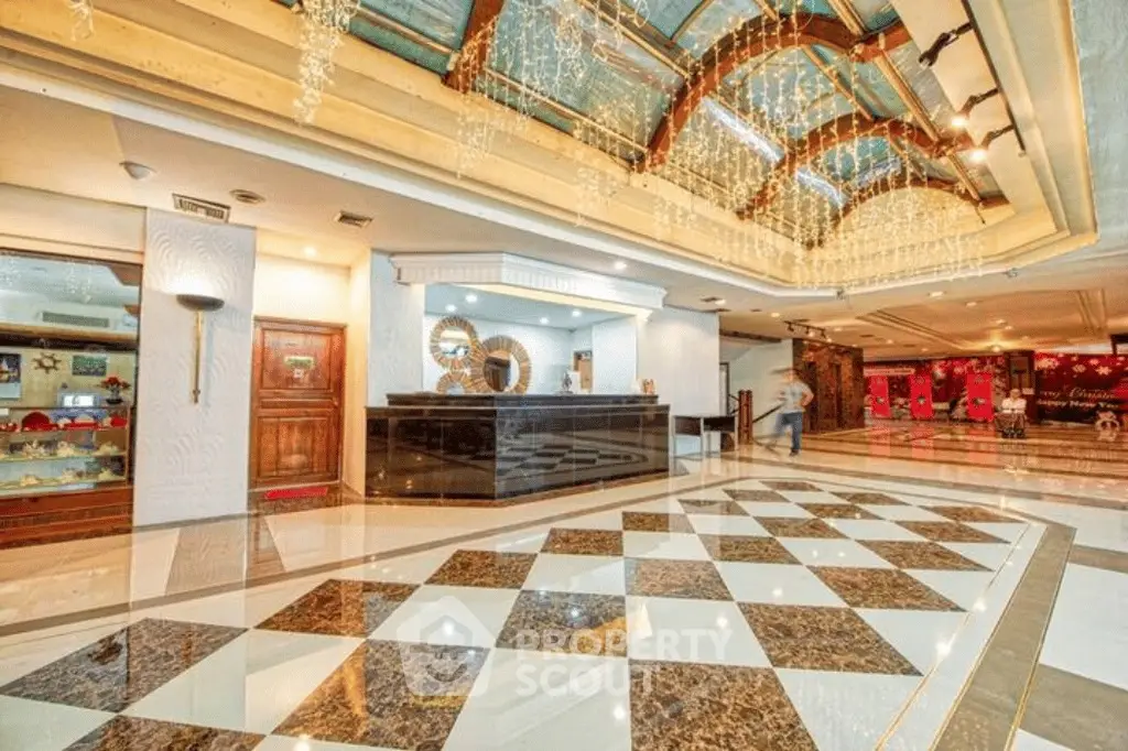 Luxurious hotel lobby with elegant chandeliers and marble flooring