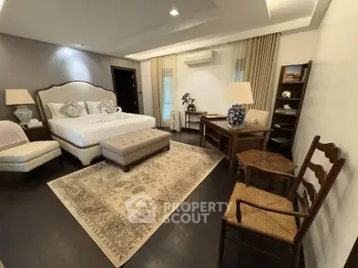 Luxurious bedroom with elegant decor, featuring a plush bed, stylish furniture, and ambient lighting for a cozy atmosphere.