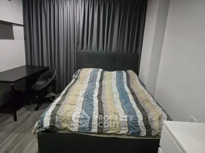 Cozy bedroom with modern decor and comfortable bed in stylish apartment.