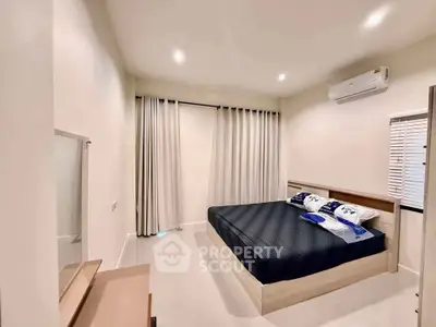 Modern bedroom with minimalist design and air conditioning