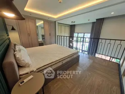 Spacious bedroom with modern design and large windows offering natural light and scenic views.