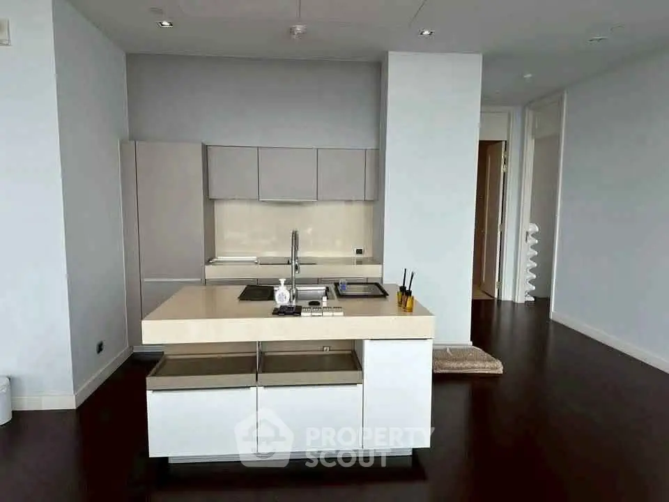 Modern kitchen with sleek design and island in upscale apartment