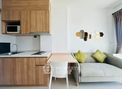 Modern compact kitchen and cozy living area with stylish decor