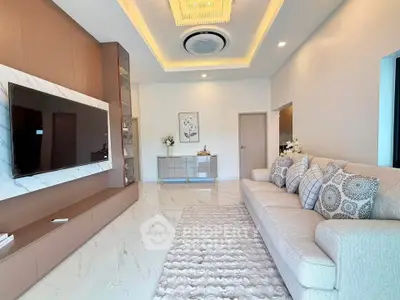Luxurious modern living room with elegant decor and spacious seating area.