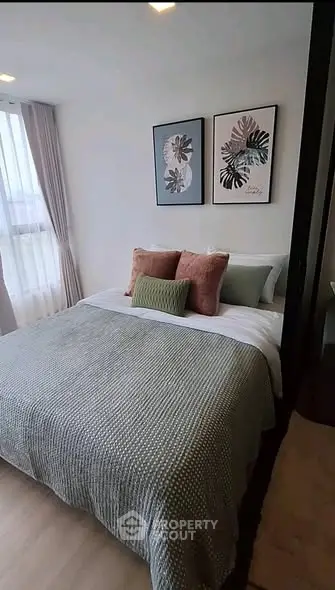 Cozy bedroom with stylish decor and natural light