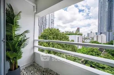 Charming balcony with city skyline view and stylish patterned floor tiles.