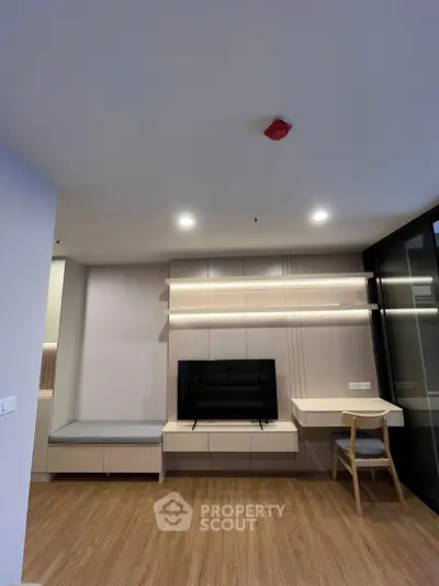 Modern living room with sleek built-in furniture and cozy seating area