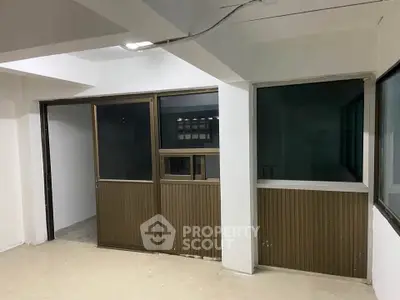 Spacious interior with large windows and modern design, ideal for office or commercial use.