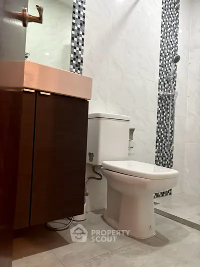 Modern bathroom with sleek fixtures and stylish tile design