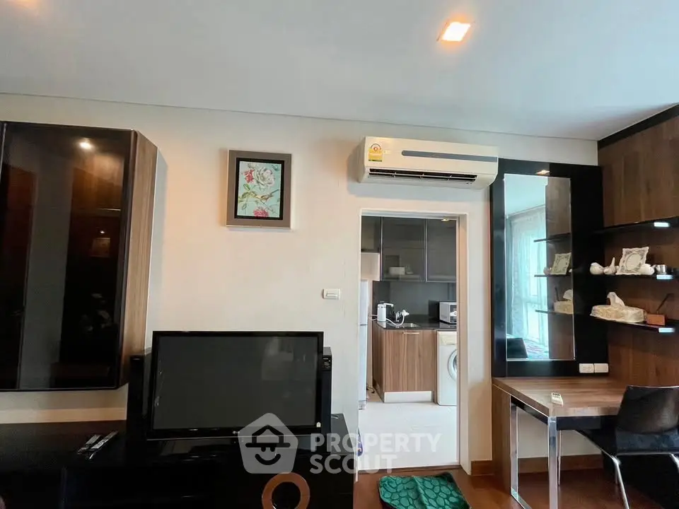 Modern living room with sleek furniture and open kitchen view