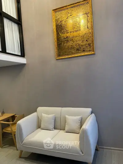 Modern living room with stylish sofa and elegant wall art