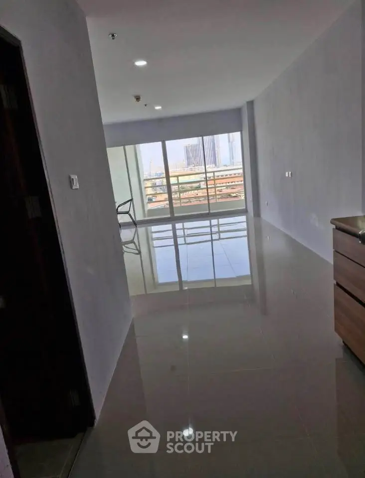 Spacious modern apartment with glossy floors and balcony view