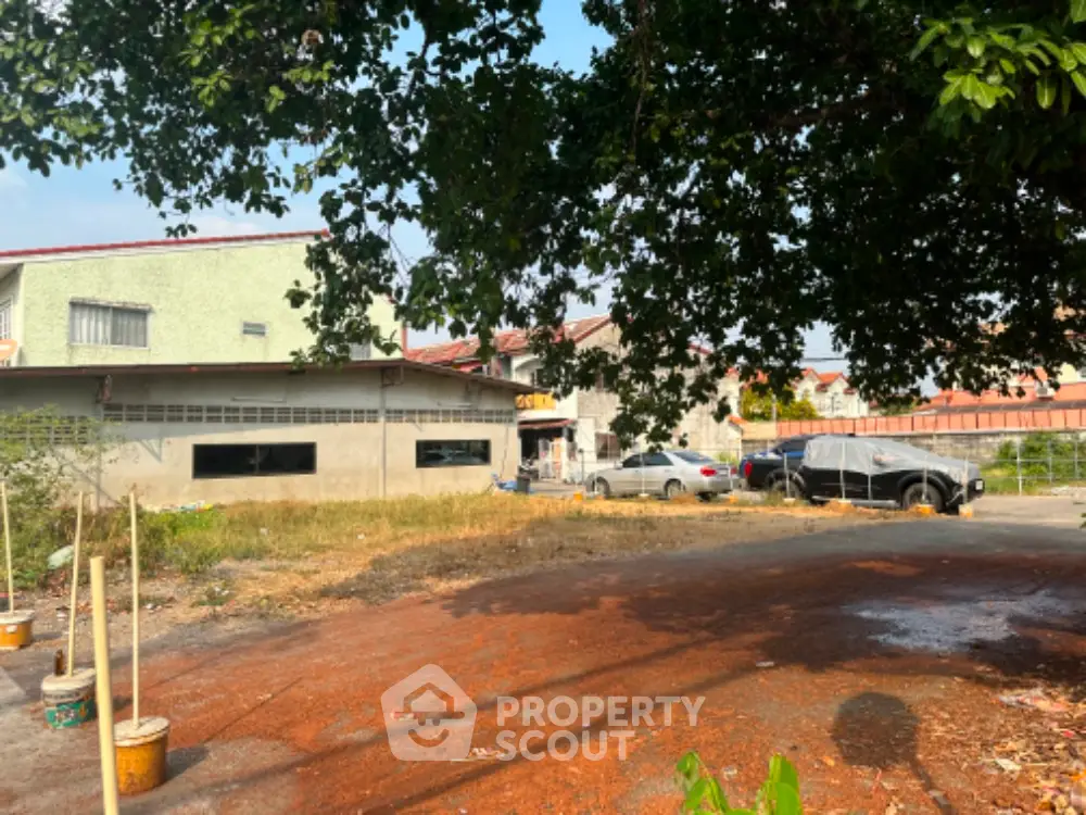 Spacious residential property with ample parking and lush greenery, ideal for development opportunities.