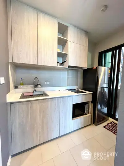 Modern kitchen with sleek cabinetry and stainless steel appliances