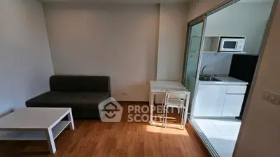 Modern studio apartment with compact kitchen and cozy living area