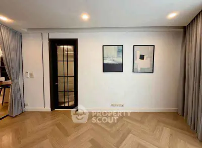 Elegant living room with modern decor and stylish parquet flooring