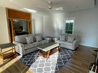 Spacious living room with modern furniture and natural light