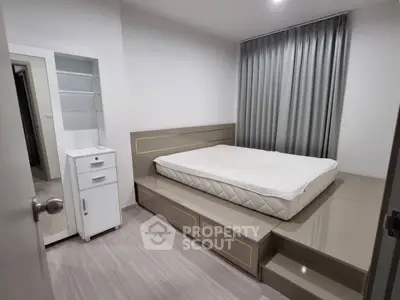 Modern bedroom with sleek design and platform bed in stylish apartment