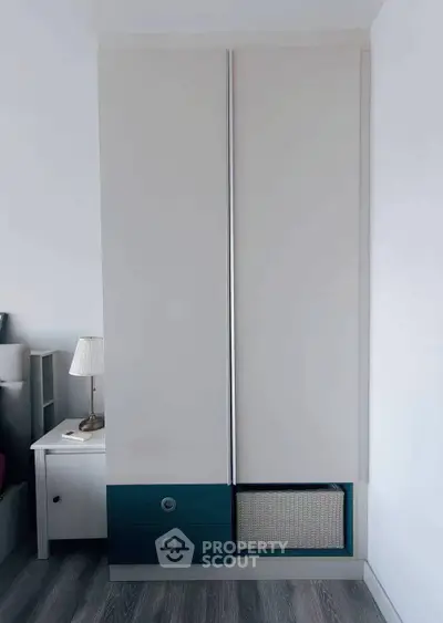 Modern bedroom with sleek wardrobe and stylish nightstand