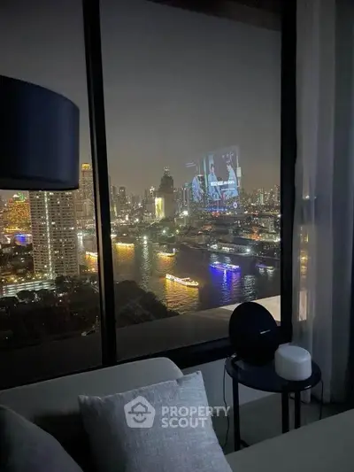 Stunning city skyline view from a modern high-rise apartment at night.