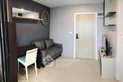 Modern living room with sleek furniture and stylish decor in a contemporary apartment.