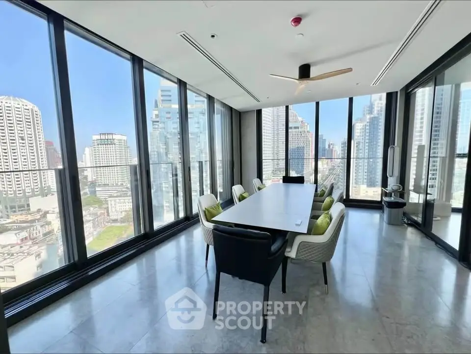 Stunning corner unit with panoramic city views and modern conference room setup.