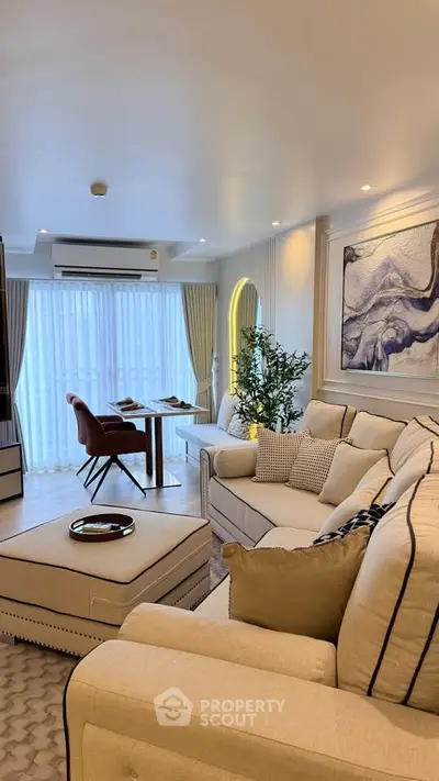 Luxurious living room with elegant decor and cozy seating, perfect for relaxation and entertainment.